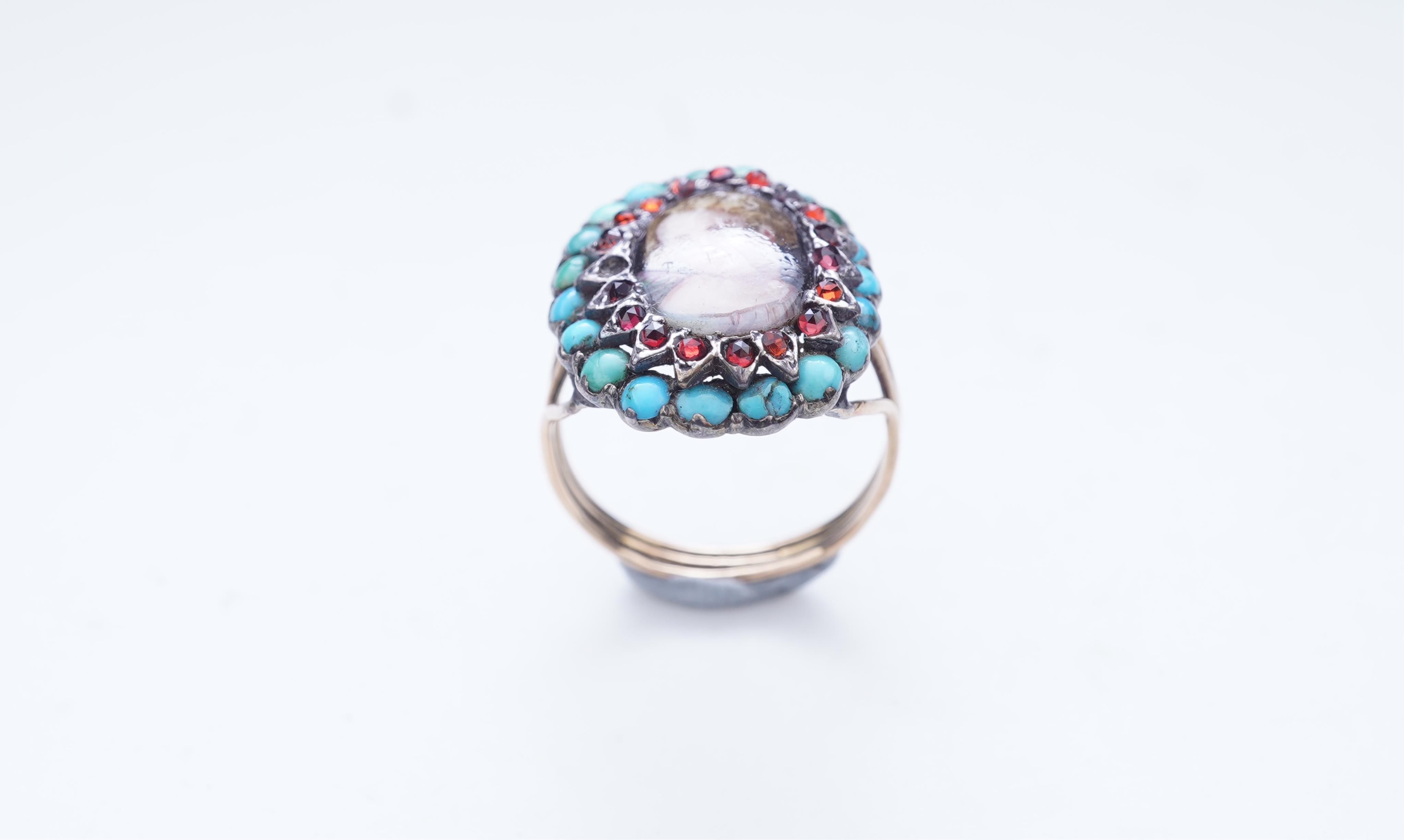An enamel miniature, turquoise and garnet ring
